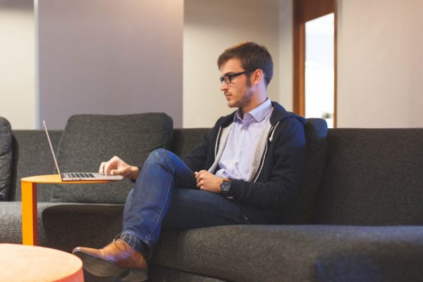 Boots CC0 computer Couch creative Crossed Legs Designer Fashion Glasses High-Resolution Jeans laptop Mac Macbook Pro man office Stock Working free photo CC0