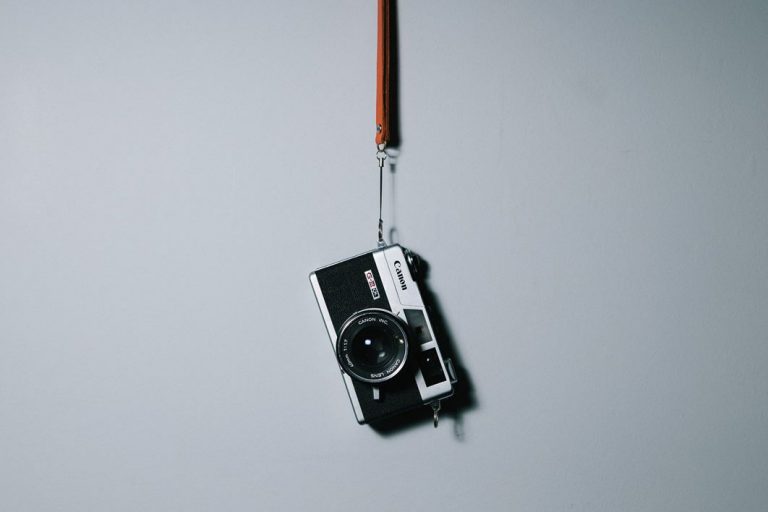 camera Canon Hanging Isolated Leather Lens Object Photo photographer Strap vintage wall free photo CC0
