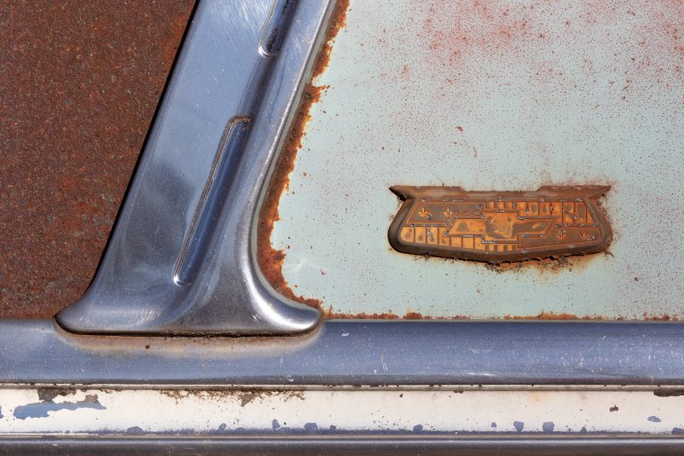 aged Antique automobile automotive badge car chevy Chrome emblem Rusty weathered Worn free photo CC0