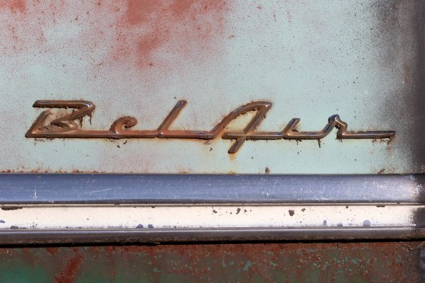 aged Antique automobile automotive badge chevy Chrome classic emblem hot rod Metal muscle car rust surface texture weathered Worn free photo CC0