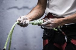picography-a-rock-climber-holds-out-knotted-rope
