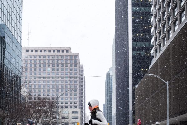 Buildings cars city exercise female lights pedestrians runner running snow snowing street tall Traffic Urban Windows Winter free photo CC0