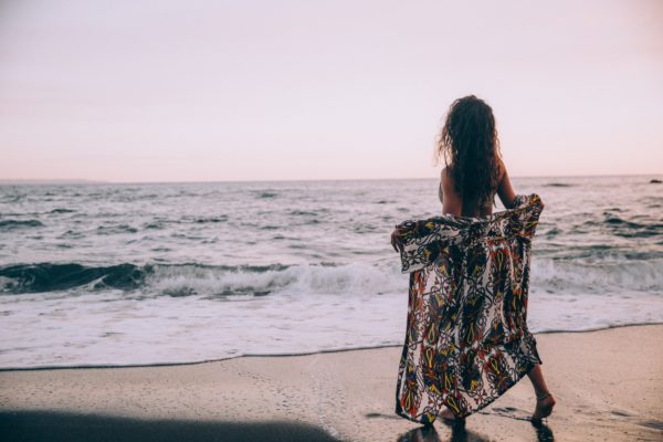 Beach calm casual Coast female Hair happy Ocean Person Sand sea shore travel Vacation water Waves woman free photo CC0