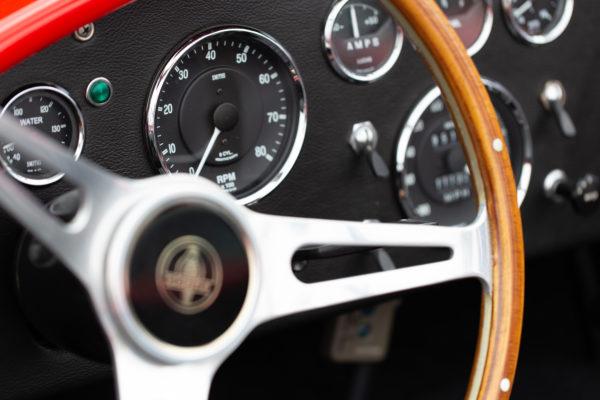 auto automobile automotive car classic dashboard fast car Gauges Interior Retro rpm sports steering wheel Transportation vintage free photo CC0