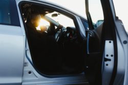 picography-a-model-in-the-driving-seat-silhouetted-by-sunlight