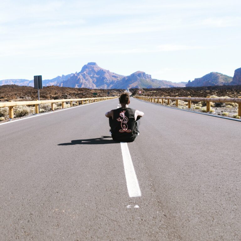 concept dashed future line Male man meditation mountains pavement Person road road sign Sitting sky Thinking free photo CC0