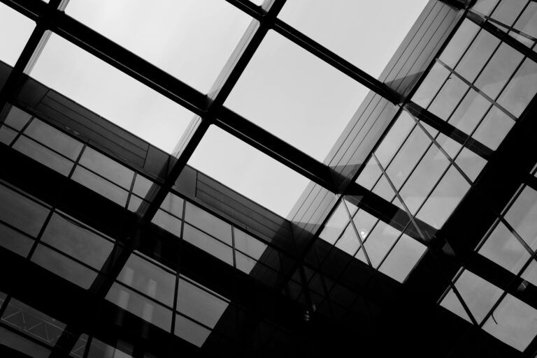 Abstract black and white building city contrast downtown Dramatic Glass gray Industrial Modern moody Pattern Perspective Structure Urban Windows free photo CC0