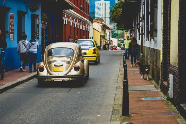 auto automobile Buildings cars Colorful pedestrians people sidewalk street tourists Transport travel Urban walking free photo CC0