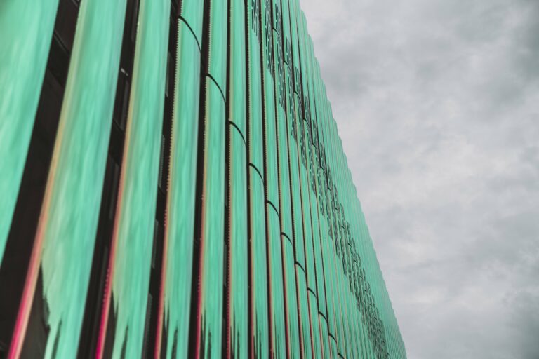 Abstract Background building business city clouds commercial corporation design exterior facade futuristic Glass green Modern Pattern Perspective sky Structure Urban wall free photo CC0