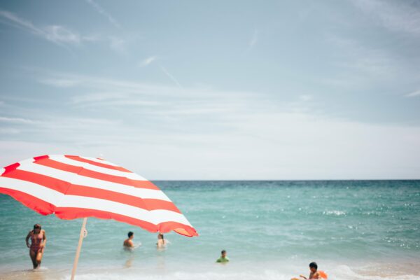 Background Beach blue clouds copy space daytime horizon Leisure Ocean outdoors people Relax saltwater Sand sea sky summer summertime Sunny Swimming swimming suit travel umbrella Warm water Waves free photo CC0