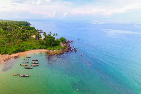 Aerial Beach beauty Boats calm canoes Coast exotic Island kayak land landscape Ocean palm trees sea shore sky summer Sunny travel Tropical water Waves free photo CC0