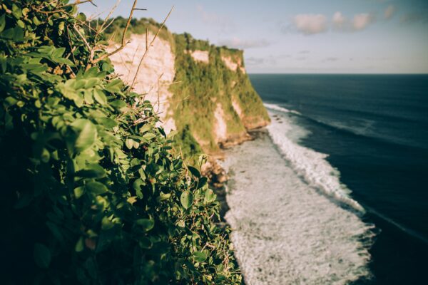 blue cliffs clouds Coast greenery Island mountains Outdoor Rock sea shore sky travel water free photo CC0