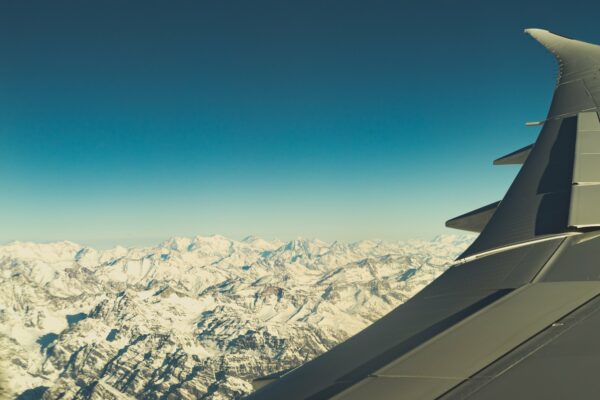 Aircraft altitude flying horizon Jet mountains Scenic sky snowy Transportation travel View free photo CC0
