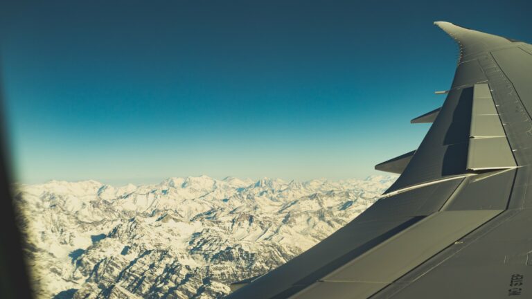 Aircraft altitude flying horizon Jet mountains Scenic sky snowy Transportation travel View free photo CC0