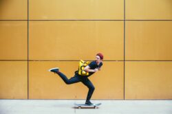 picography-skateboarder-rides-past