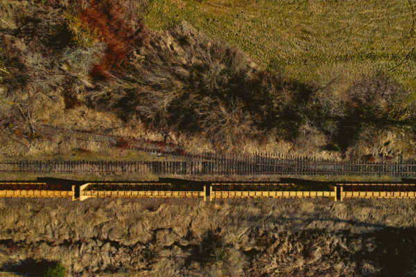 above Abstract Aerial autumn Bare Drone dry Fall grass land rural terrain tracks Train Transport travel trees View free photo CC0