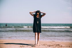 picography-tattooed-woman-on-beach-with-toes-in-the-sand